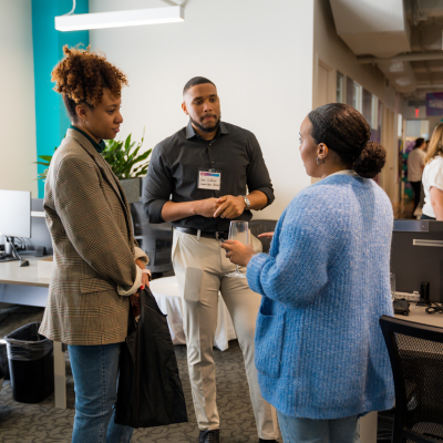 Zoe chatting with members at DDC open house 2022