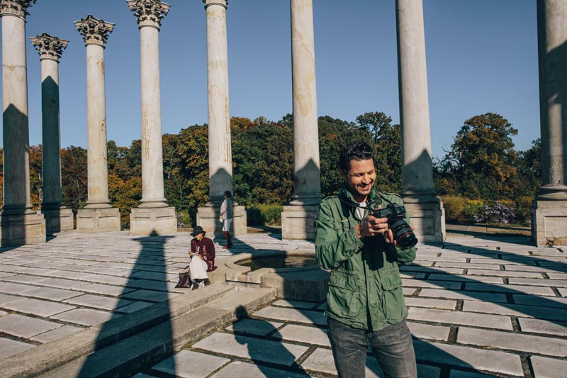 Man taking photographs of the National Arboretum National Capitol Columns - The most Instagrammable places in Washington, DC